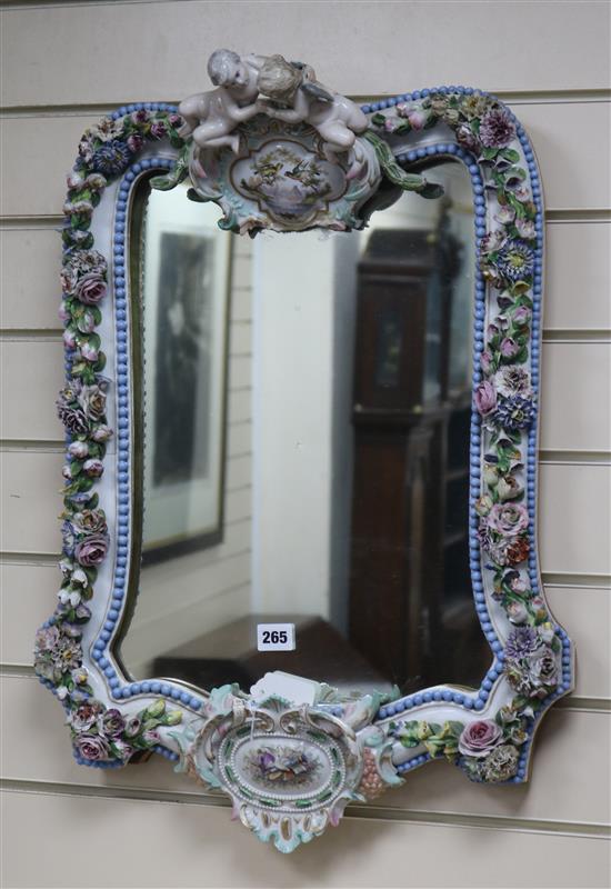 A Dresden flower encrusted wall mirror